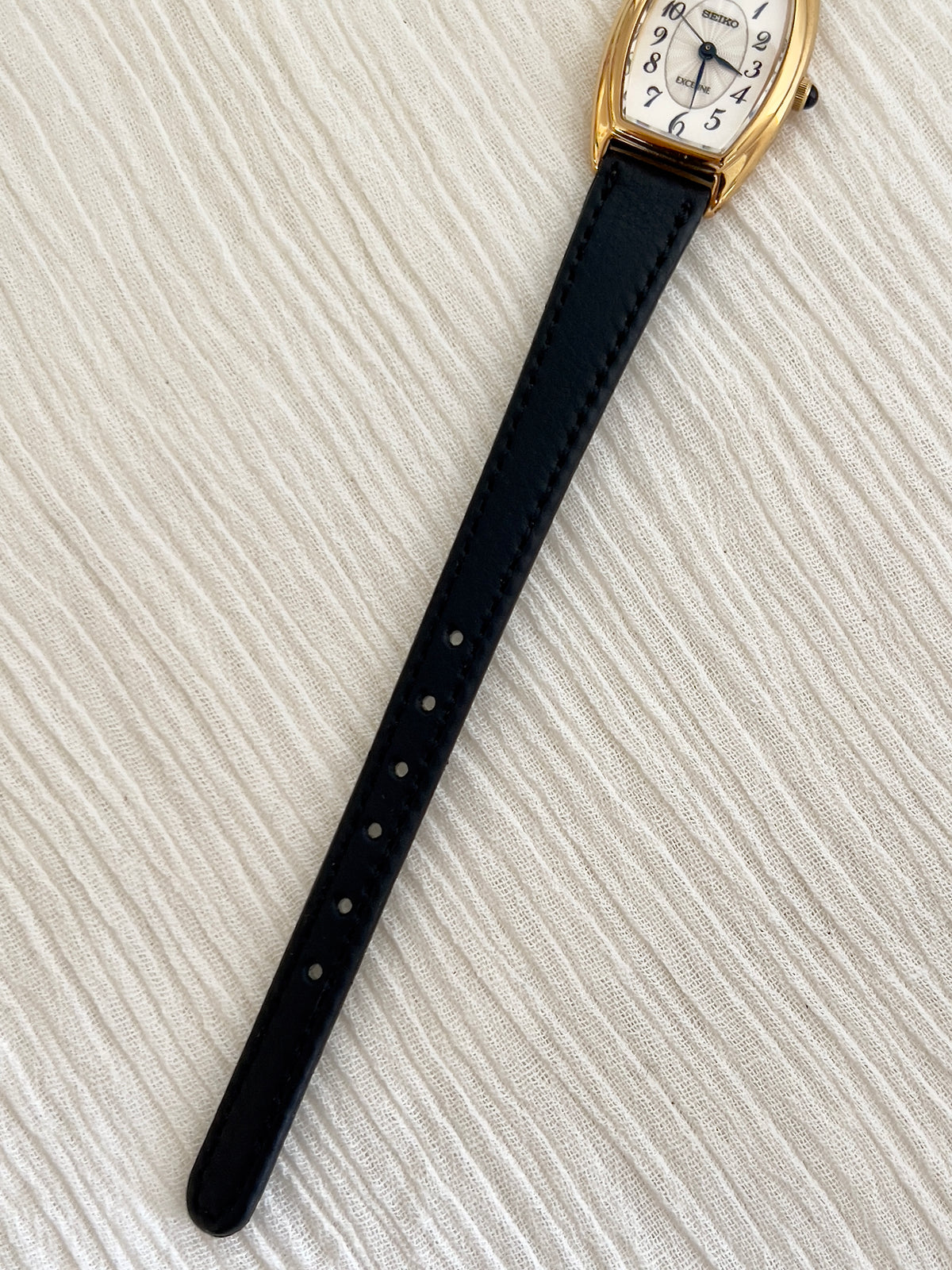 Seiko Exceline Gold Tonneau Women’s Watch with Arabic Dial — full watch and strap fittings.