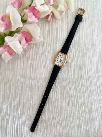Seiko Exceline Gold Tonneau Women’s Watch with Arabic Dial — full watch and black leather strap.