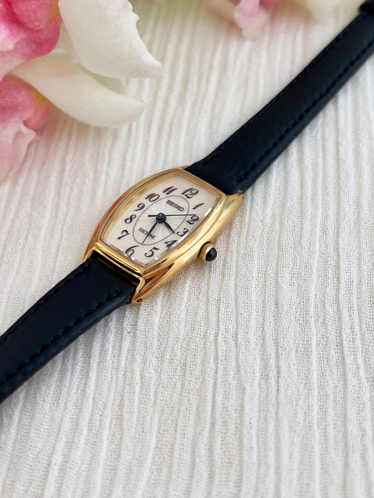 Seiko Exceline Gold Tonneau Women’s Watch with Arabic Dial — angled view of patterned Arabic dial.
