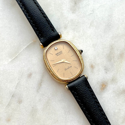 Seiko Exceline One Diamond Gold Dial Leather watch 2320-6200: close view of the dial and case.