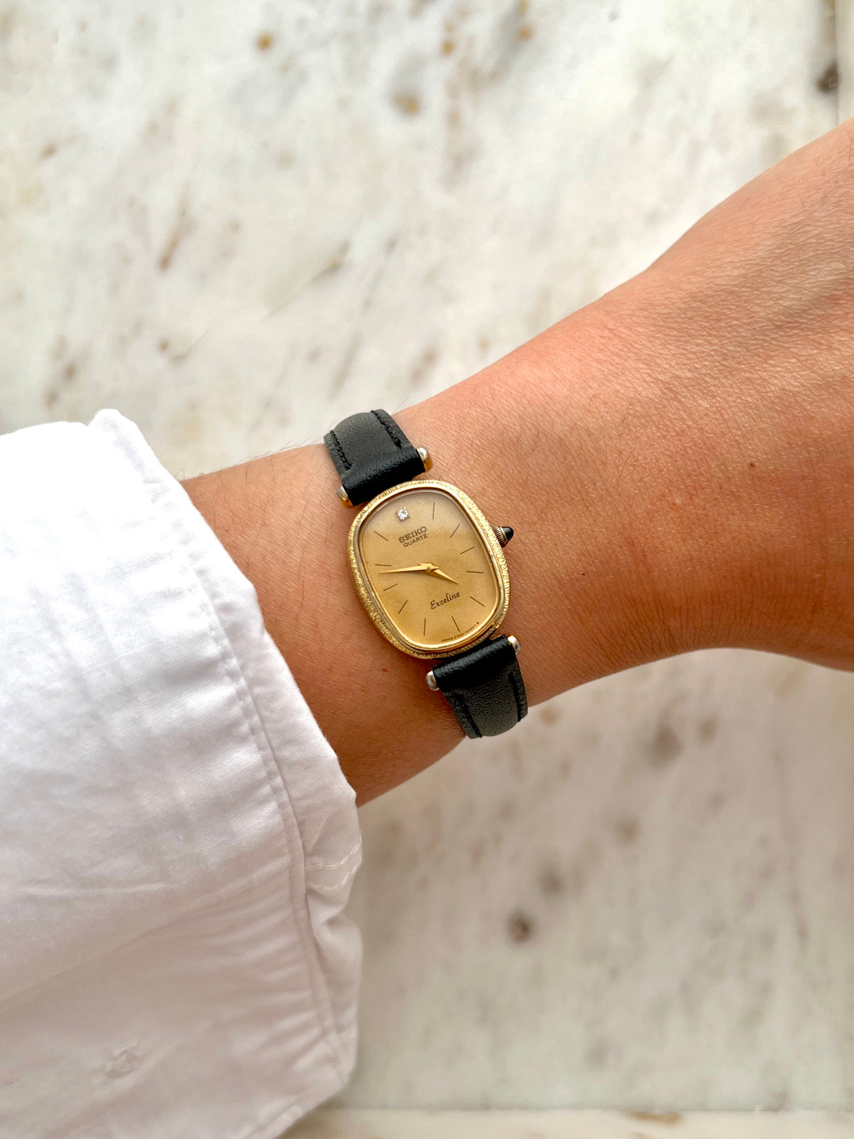 Seiko Exceline One Diamond Gold Dial Leather watch 2320-6200: watch worn on the wrist.