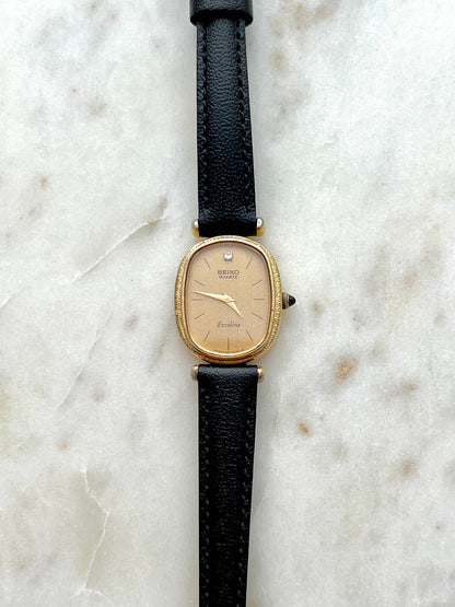 Seiko Exceline One Diamond Gold Dial Leather watch 2320-6200: full front view of the watch.
