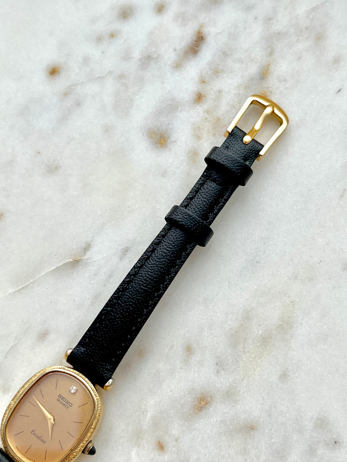 Seiko Exceline One Diamond Gold Dial Leather watch 2320-6200: strap and buckle detail.