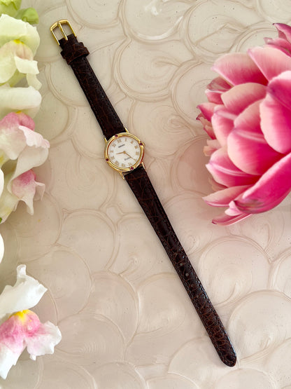 Seiko Exceline Mother of Pearl Women’s Watch with Ruby Accents — full watch and brown strap.
