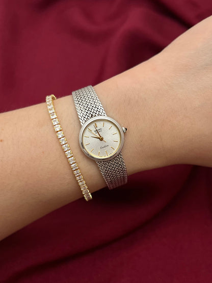 Seiko Exceline Silver Mesh Women’s Watch with Ribbed Bezel — watch worn on the wrist.
