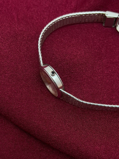 Seiko Exceline Silver Mesh Women’s Watch with Ribbed Bezel — side view of the case and crown.