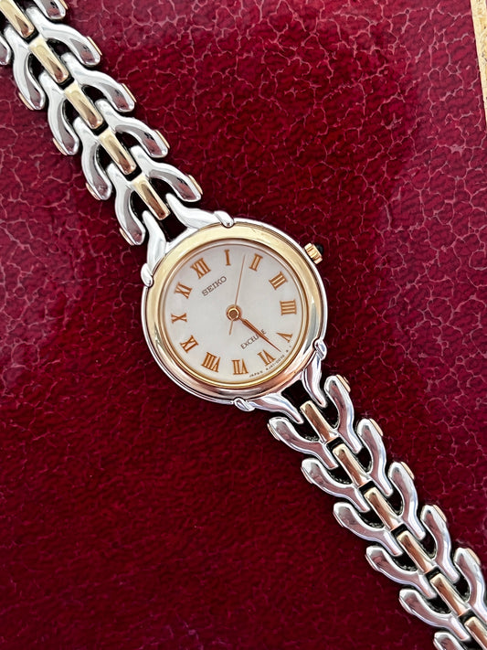 Seiko Exceline Roman Dial Two Tone Women’s Watch featuring white dial and integrated bracelet; vintage watch product image 1.