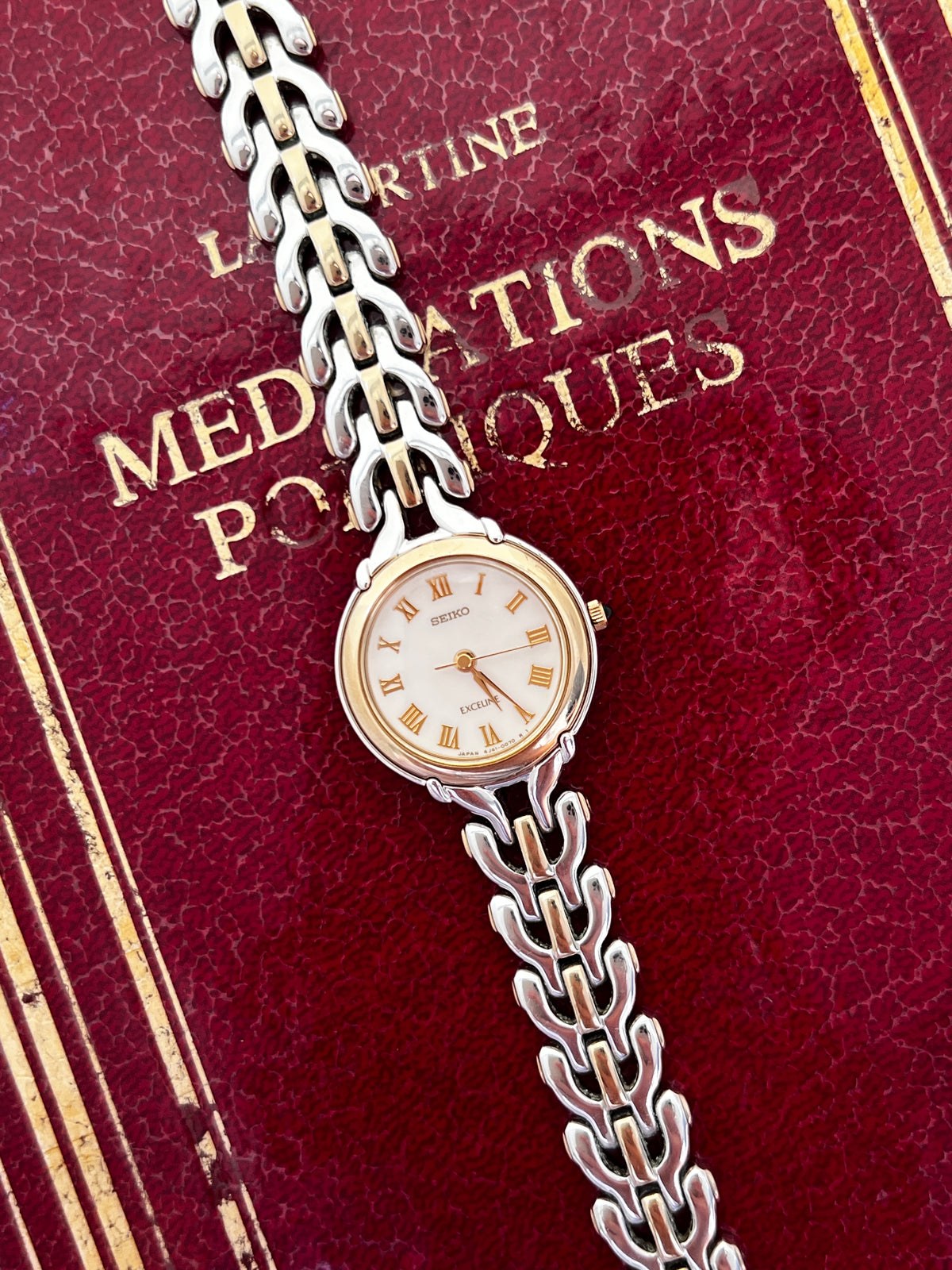 Seiko Exceline Roman Dial Two Tone Women’s Watch featuring white dial and integrated bracelet; vintage watch product image 2.