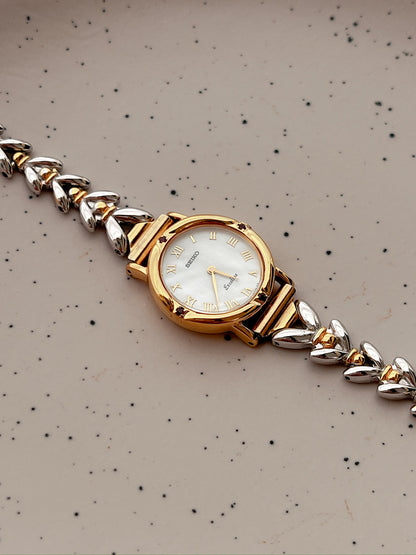 Seiko Exceline Ruby Accent Two Tone Women’s Watch featuring mother of pearl dial and two tone bracelet; vintage watch product image 3.