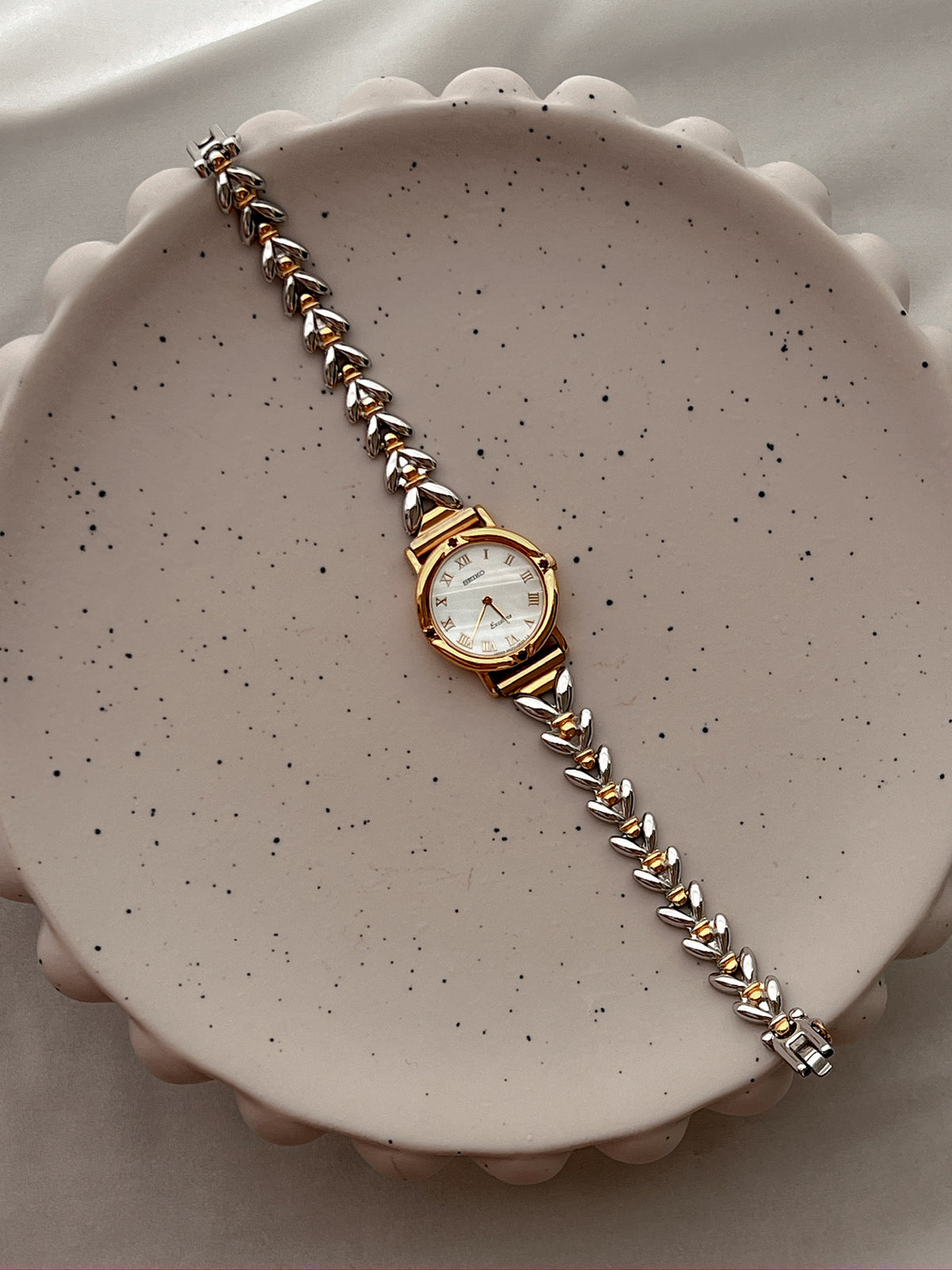 Seiko Exceline Ruby Accent Two Tone Women’s Watch featuring mother of pearl dial and two tone bracelet; vintage watch product image 4.