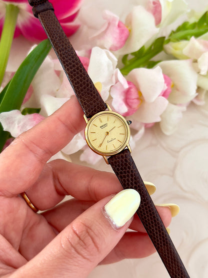 Gold-tone case profile of the Seiko Exceline women's watch.