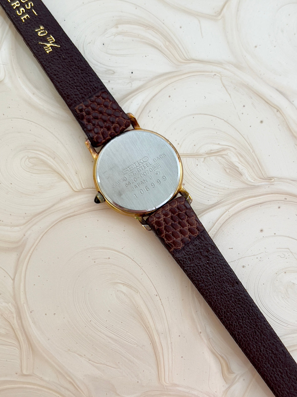 Seiko Exceline champagne dial watch pictured on a wrist.