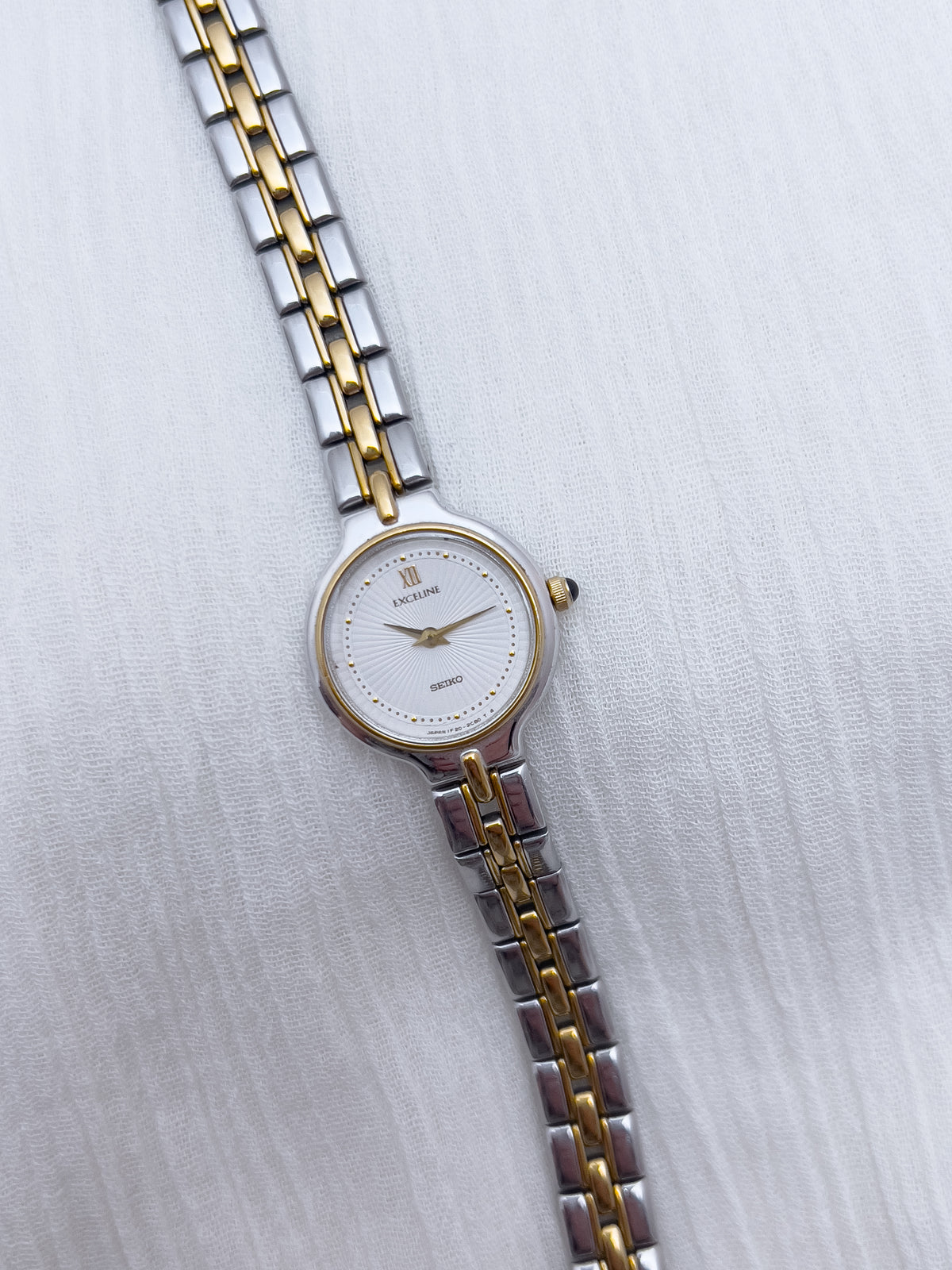 Seiko Exceline Woman's Watch with Sunburst Dial, case profile of a vintage women's watch at Gilded Hour.