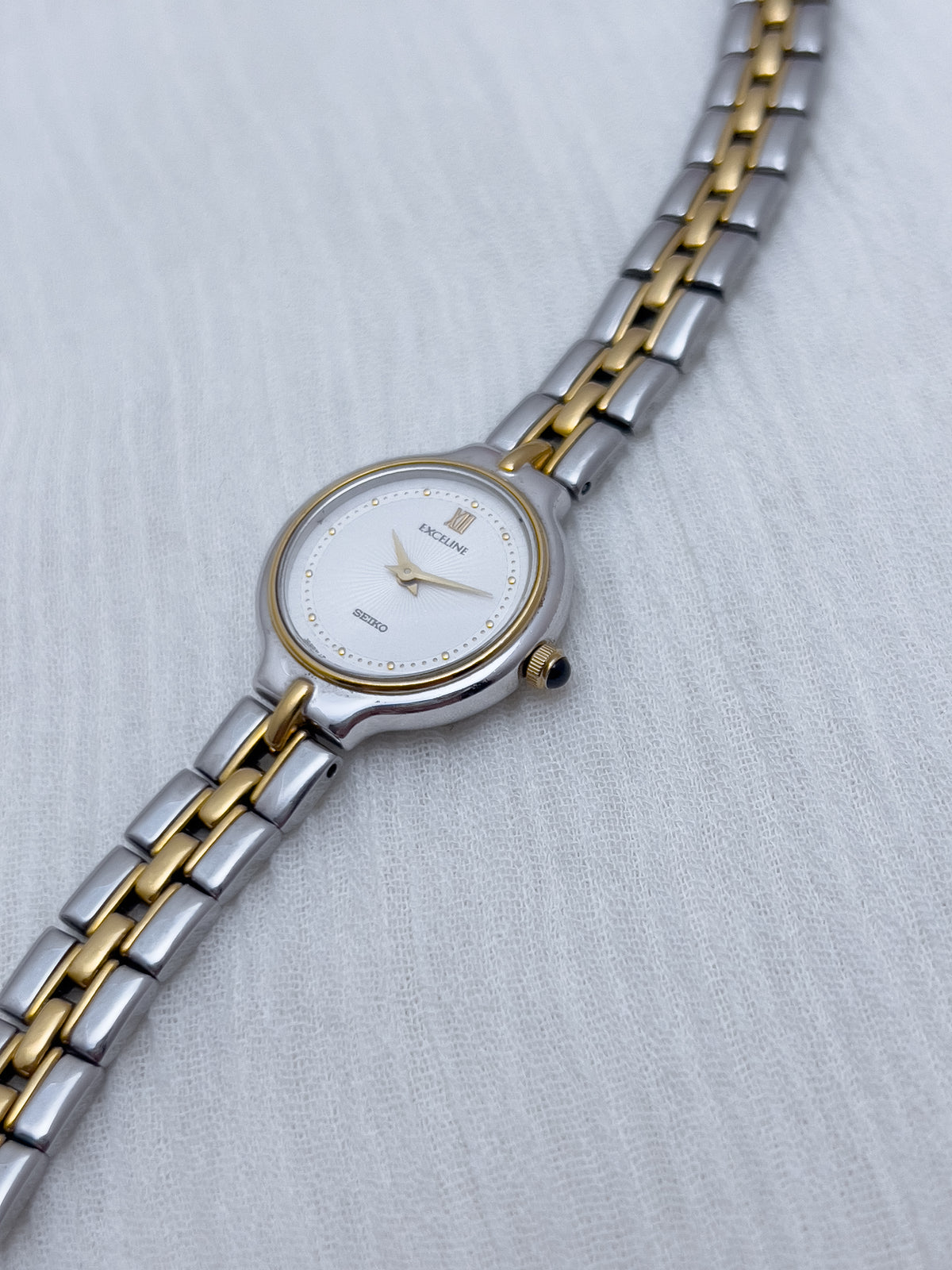 Seiko Exceline Woman's Watch with Sunburst Dial, bracelet detail of a vintage women's watch at Gilded Hour.