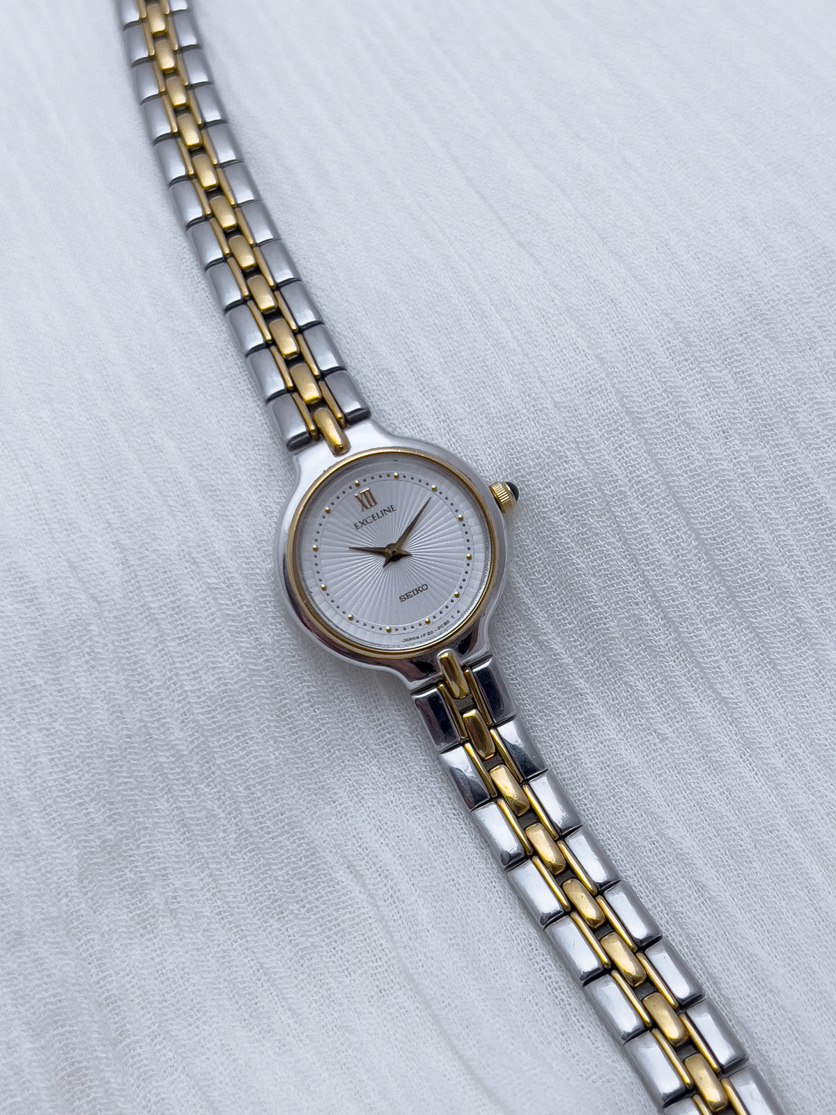 Seiko Exceline Woman's Watch with Sunburst Dial, angled view of a vintage women's watch at Gilded Hour.