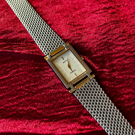 Featured product image: Seiko Exceline tank women's watch with white dial, sapphire crystal, and Milanese mesh bracelet.
