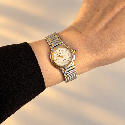 Seiko Exceline two tone silver dial watch worn on wrist in warm golden hour light