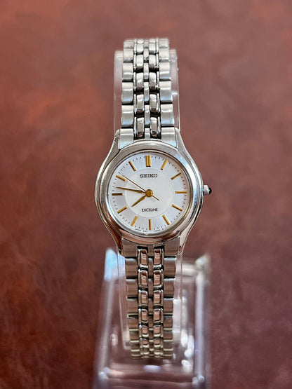 Seiko Exceline pale blue dial watch with gold hands and a silver bracelet, product photograph 2.
