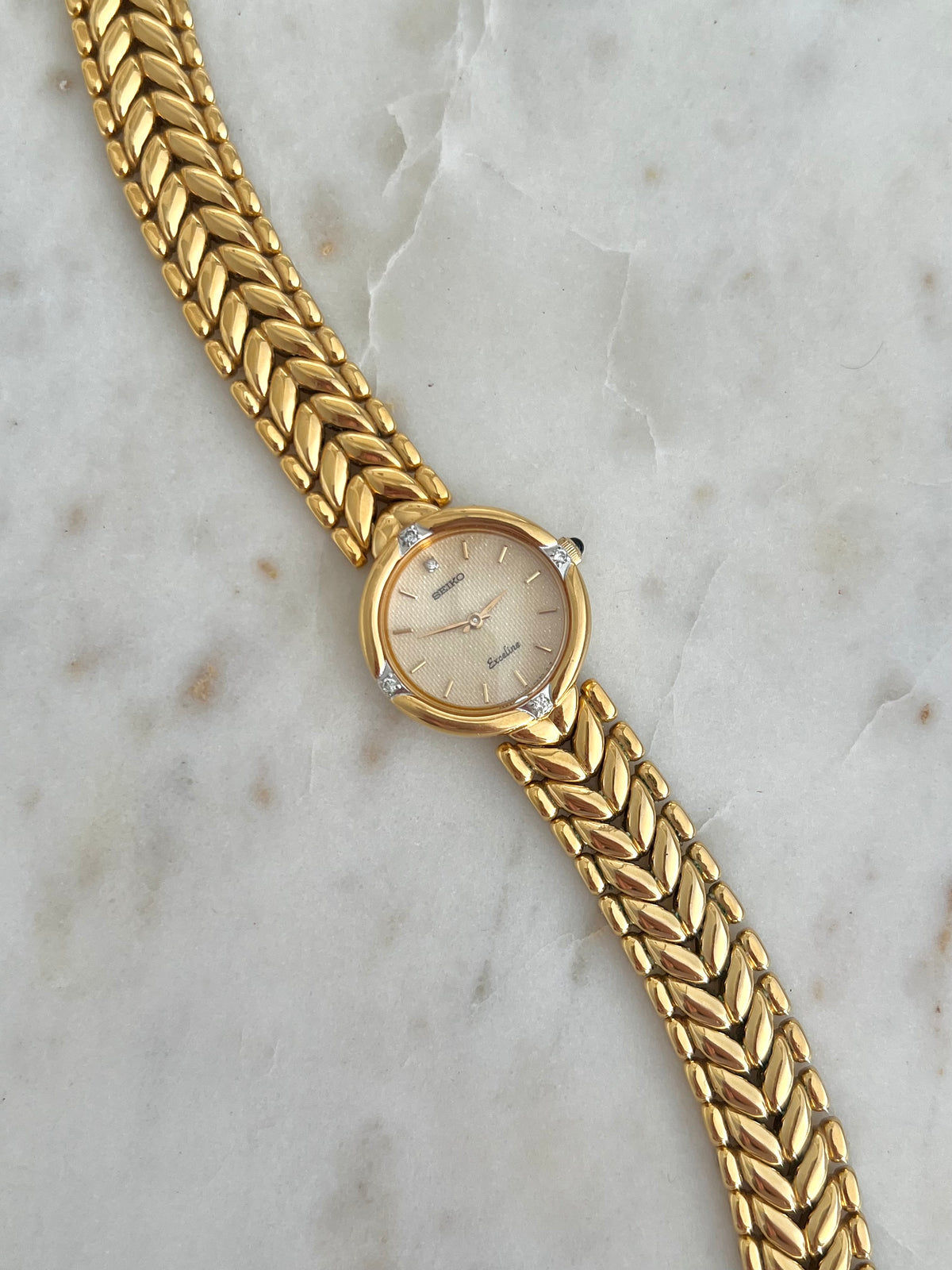 Seiko Exceline Woman's Watch with Diamonds and Sculpted Pattern Bracelet, dial close up of a vintage women's watch at Gilded Hour.