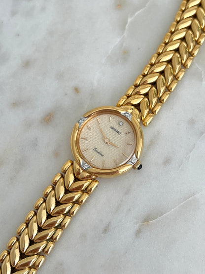 Seiko Exceline Woman's Watch with Diamonds and Sculpted Pattern Bracelet, case profile of a vintage women's watch at Gilded Hour.