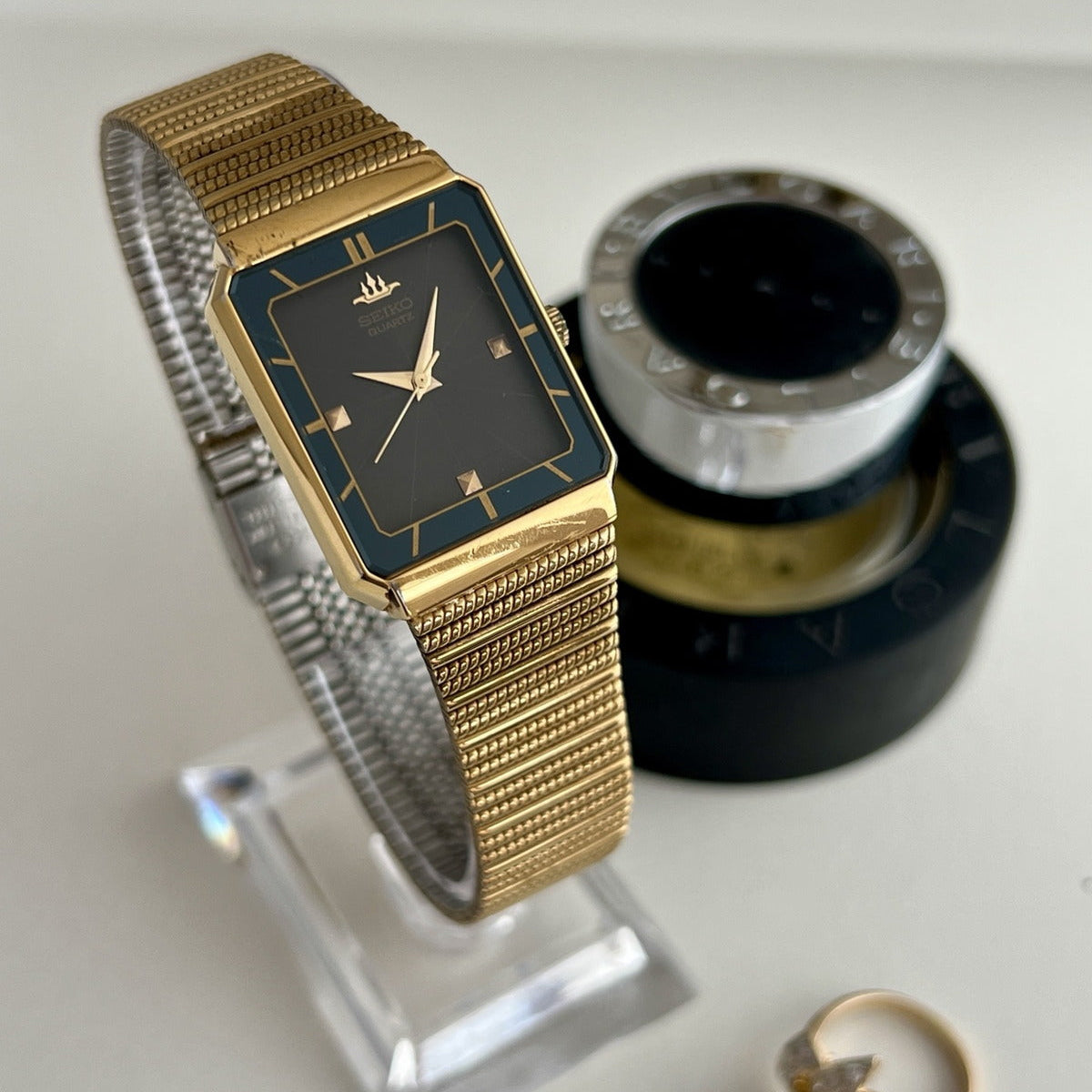 Angled view of the 1989 Seiko Galaxy gold tone women’s watch with rectangular dial and adjustable textured bracelet.