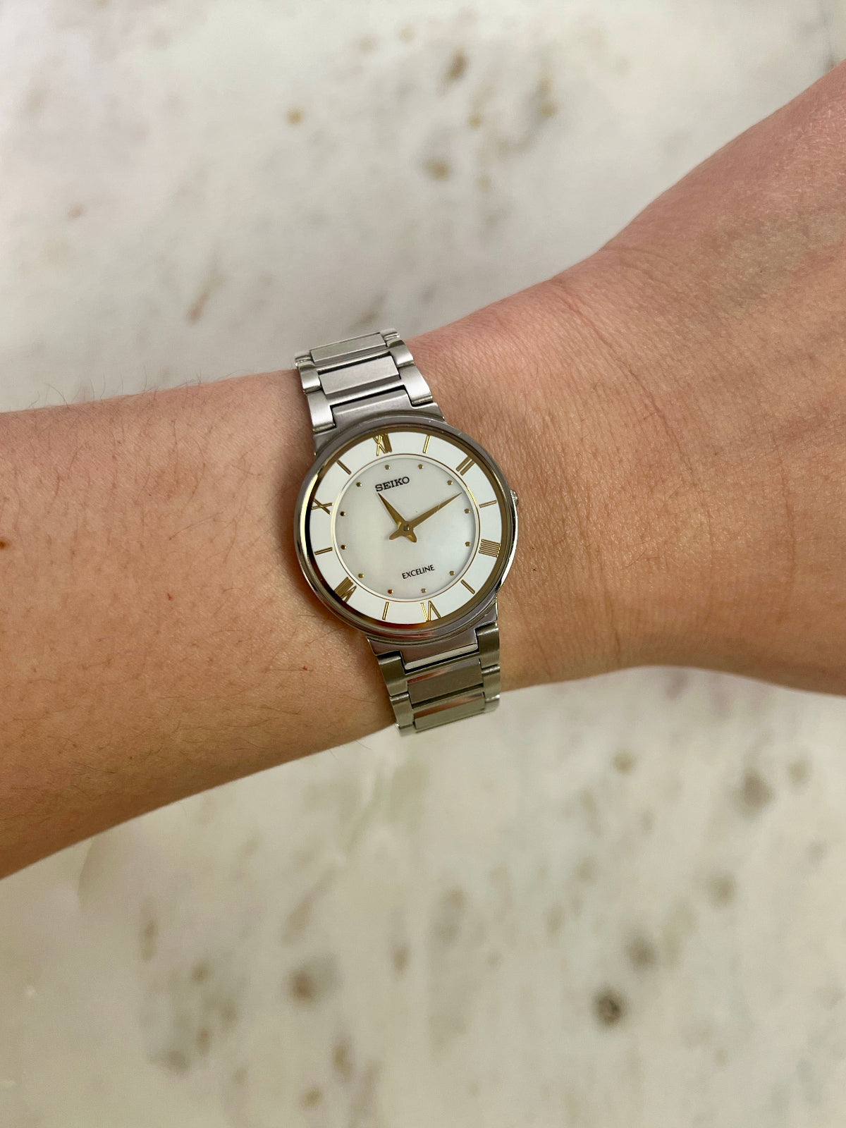 Seiko Exceline Mother of Pearl Silver Bracelet Women’s Watch; integrated silver tone bracelet with brushed and polished links. Product photograph 2 of 9.