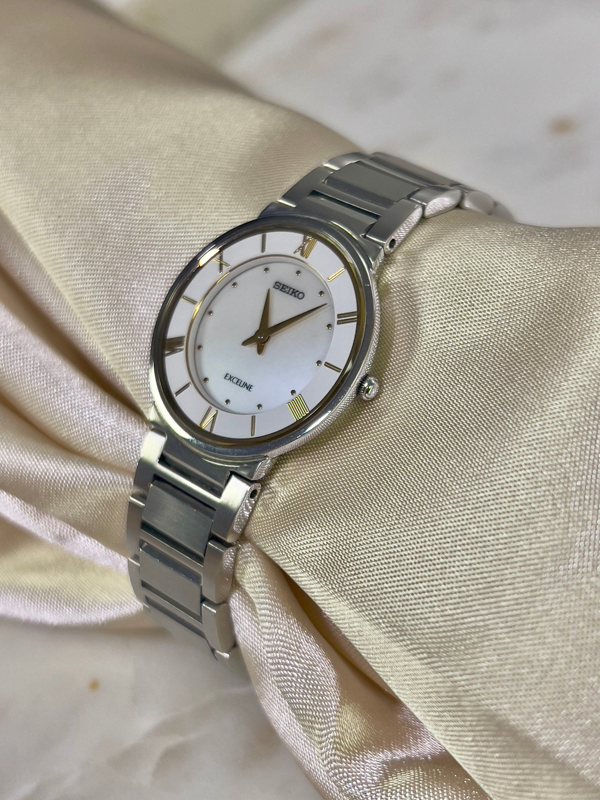 Seiko Exceline Mother of Pearl Silver Bracelet Women’s Watch; integrated silver tone bracelet with brushed and polished links. Product photograph 6 of 9.