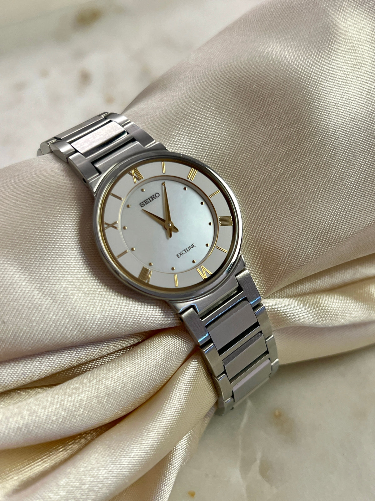 Seiko Exceline Mother of Pearl Silver Bracelet Women’s Watch; integrated silver tone bracelet with brushed and polished links. Product photograph 8 of 9.