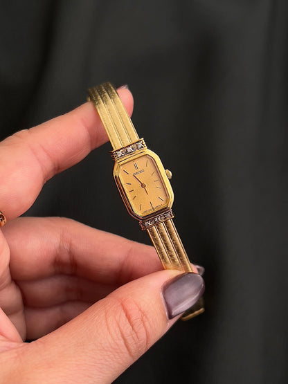 Second close-up of the Seiko dial and applied gold hour markers.