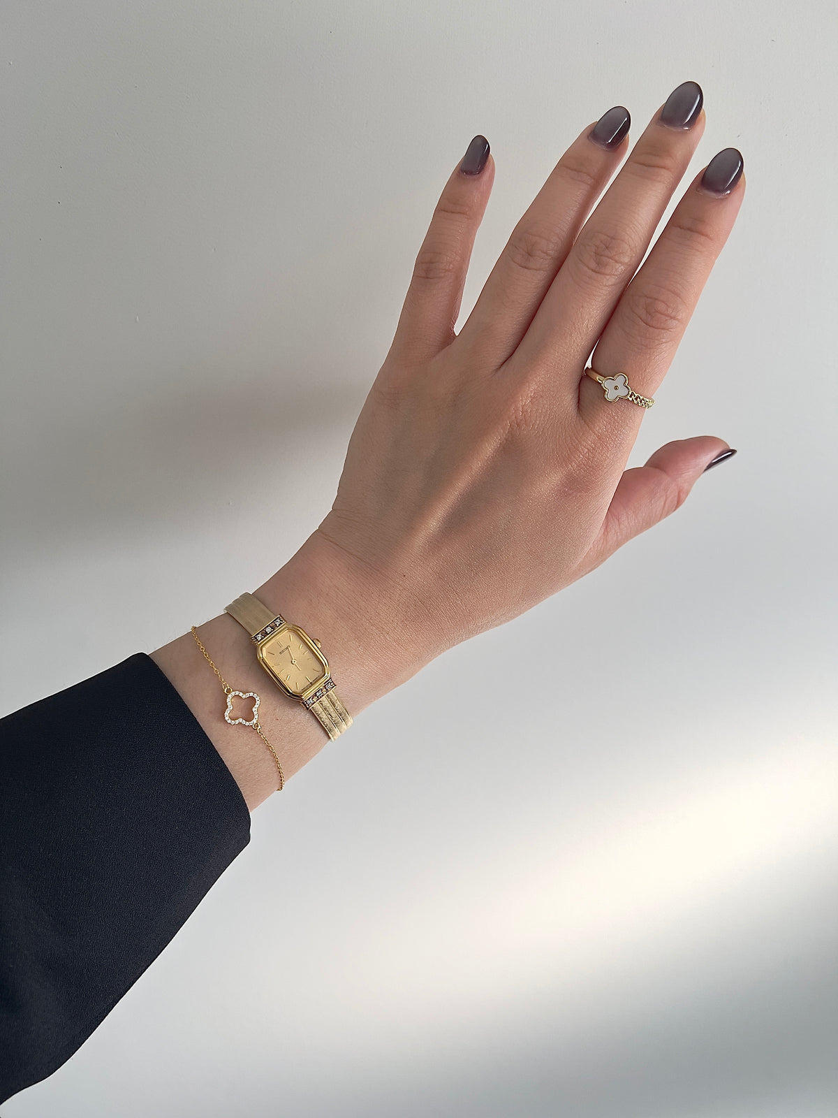 Seiko gold-tone crystal accent watch shown on a wrist.