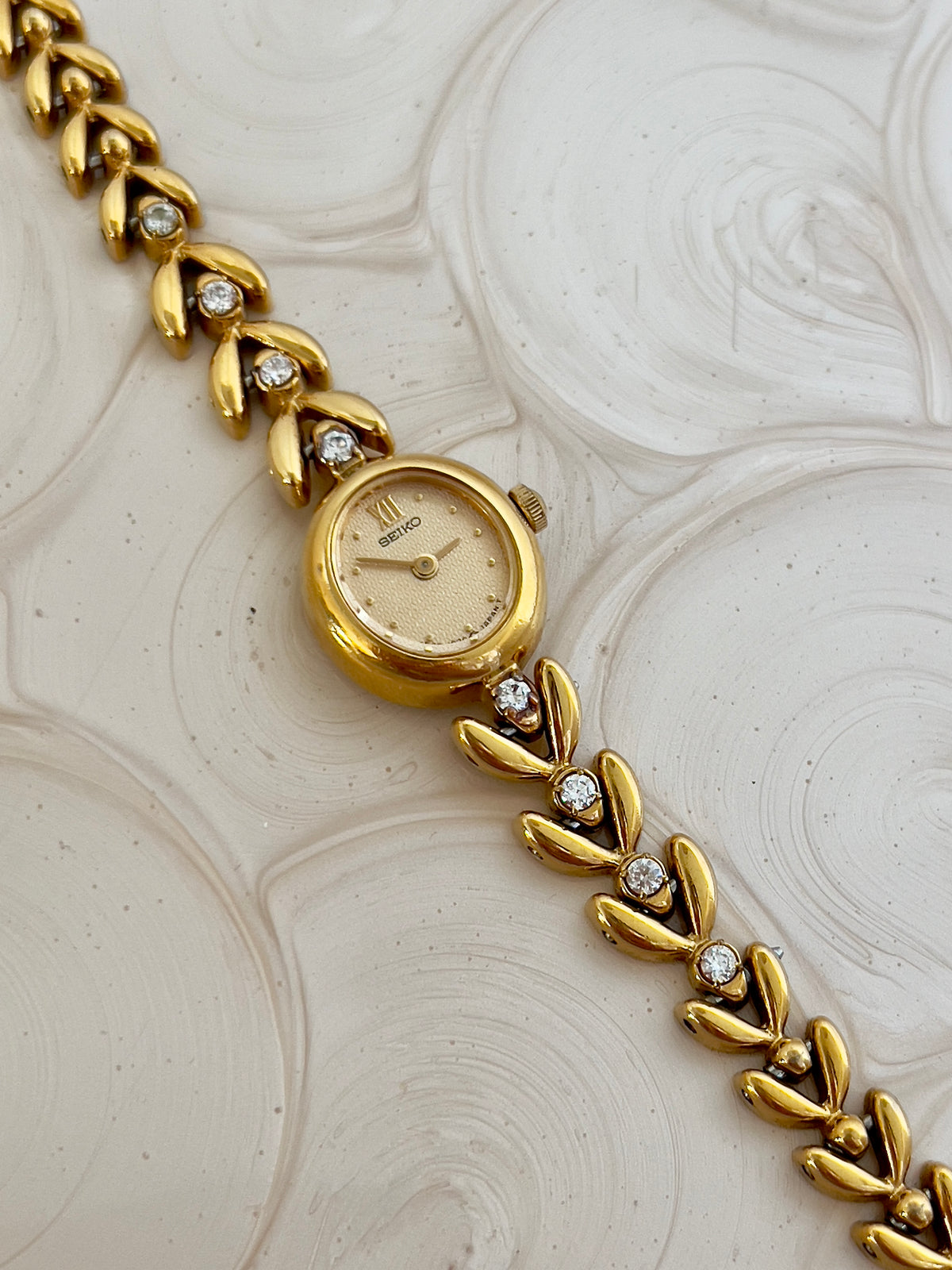 Side profile of the petite oval case on the Seiko watch.