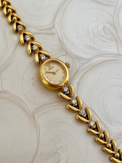 Side profile of the petite oval case on the Seiko watch.