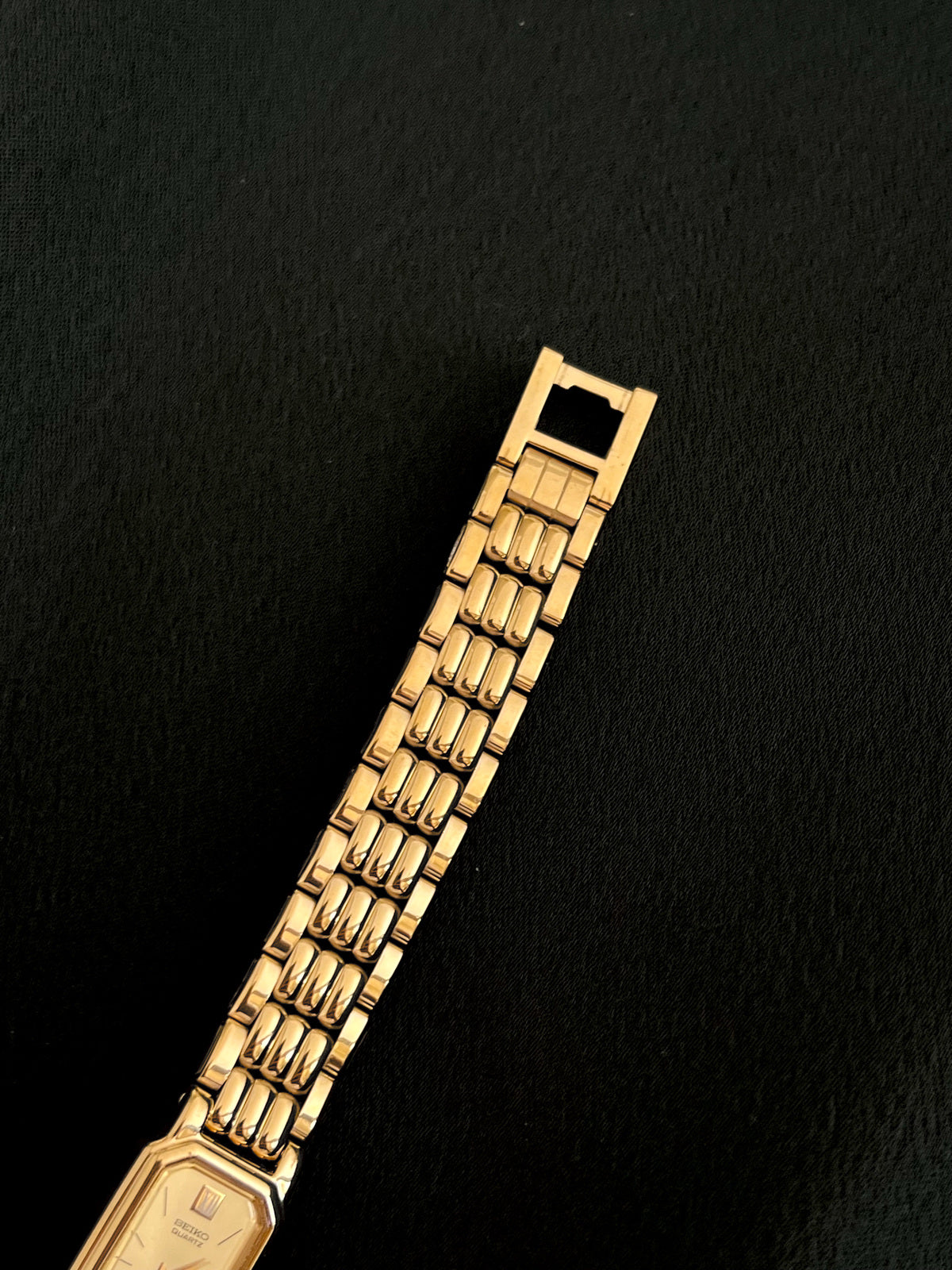 Reverse view of Seiko gold-tone bracelet and folding clasp