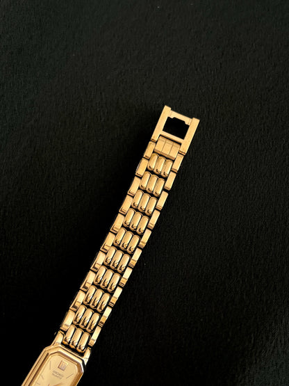 Reverse view of Seiko gold-tone bracelet and folding clasp