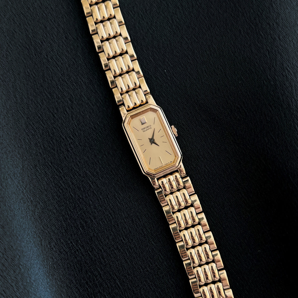 Seiko champagne dial and gold-tone bracelet detail
