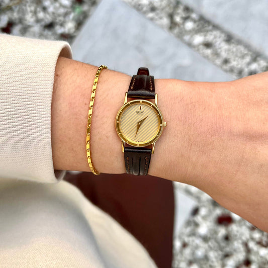 Seiko Round Gold Ladies Watch — watch face and case shown from the front.
