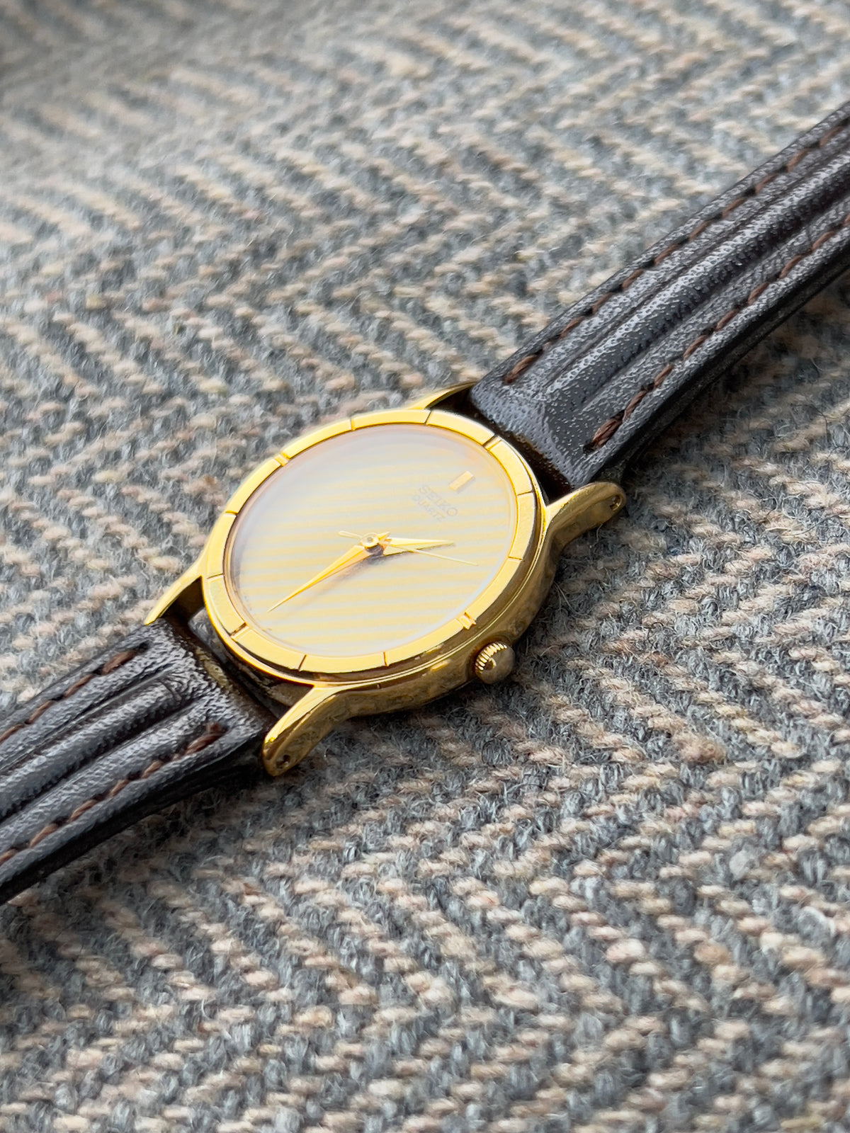 Seiko Gold Tone Striped Dial Leather Strap Women's Watch | Product photograph 6