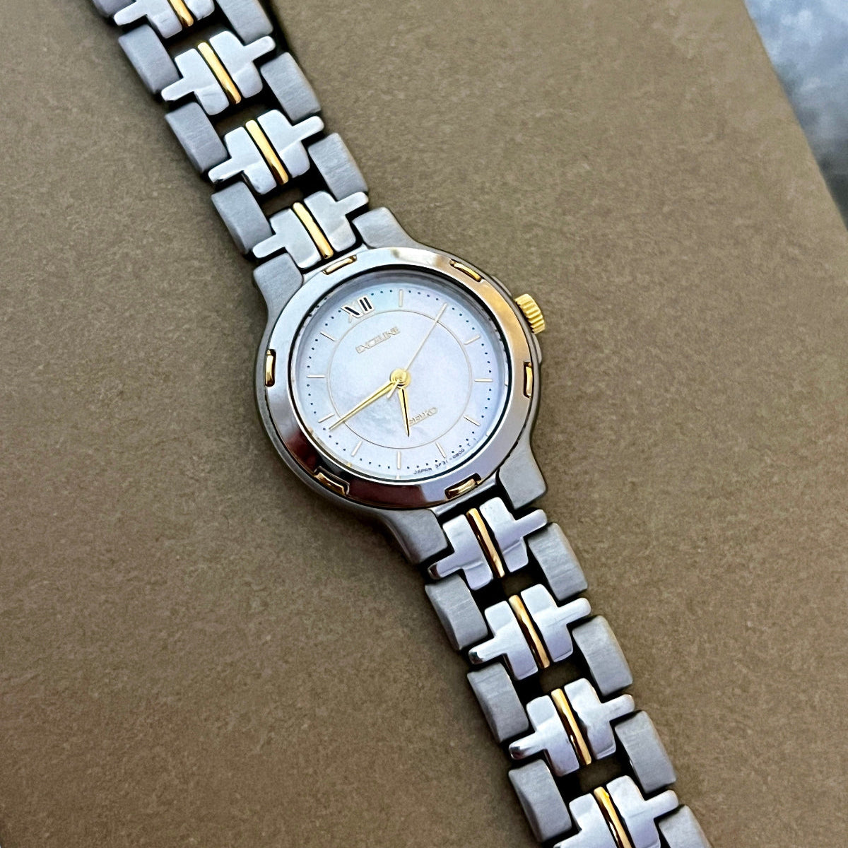 Seiko Exceline Bold Two Tone Woman's Watch with Pearl Dial, dial close up of a vintage women's watch at Gilded Hour.