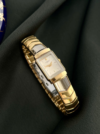 Angled view of the Seiko Lassale 1F20-6C70 showing the champagne dial and segmented gold-tone bracelet