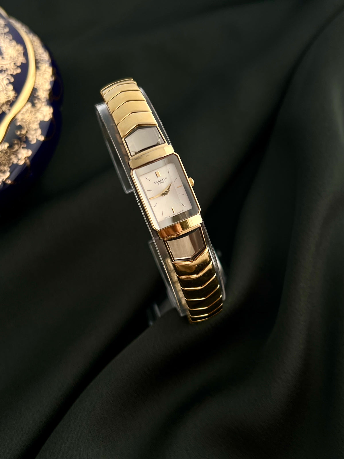 Front view of the Seiko Lassale 1F20-6C70 rectangular watch with champagne dial and gold baton markers