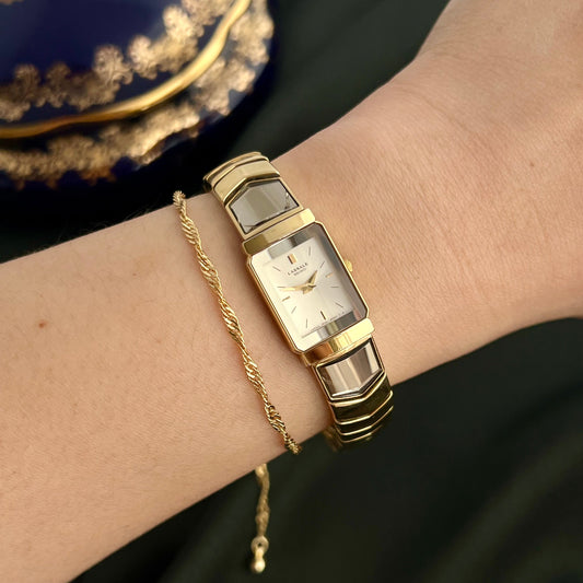 Seiko Lassale 1F20-6C70 gold-tone rectangular bracelet watch shown on the wrist