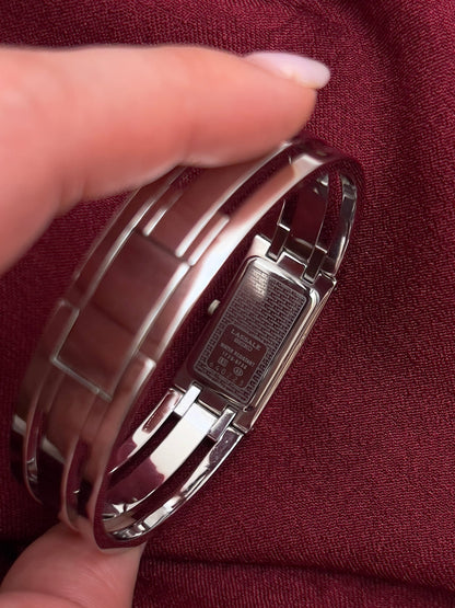 Seiko Lassale Charcoal Dial Silver Bangle Women’s Watch, caseback inside the bangle.