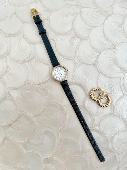 Front view of the Seiko L'Espoir round two-tone watch with Roman dial.