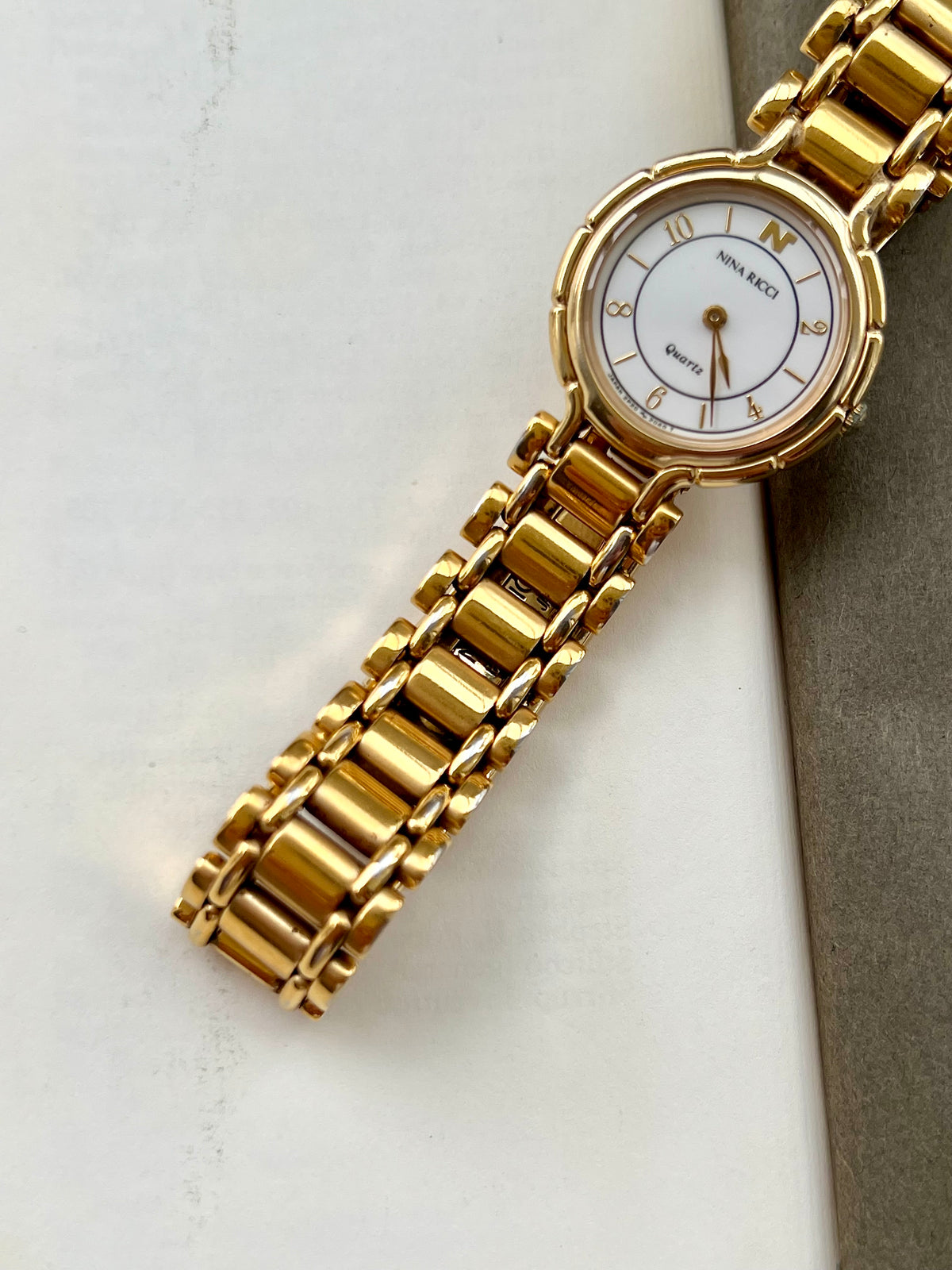 Nina Ricci White Arabic Dial Gold Tone Women's Watch | Product photograph 5
