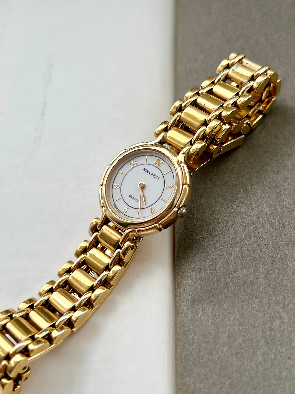 Nina Ricci White Arabic Dial Gold Tone Women's Watch | Product photograph 6