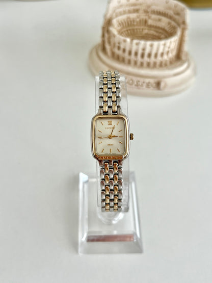 Front view of Seiko Lucent 4N21-5150 women’s watch with ivory dial and two tone bracelet