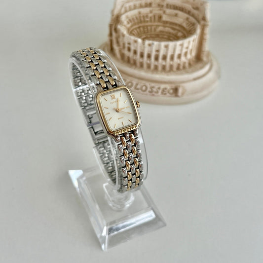 Seiko Lucent two tone rectangular women’s watch with ivory dial shown at an angle