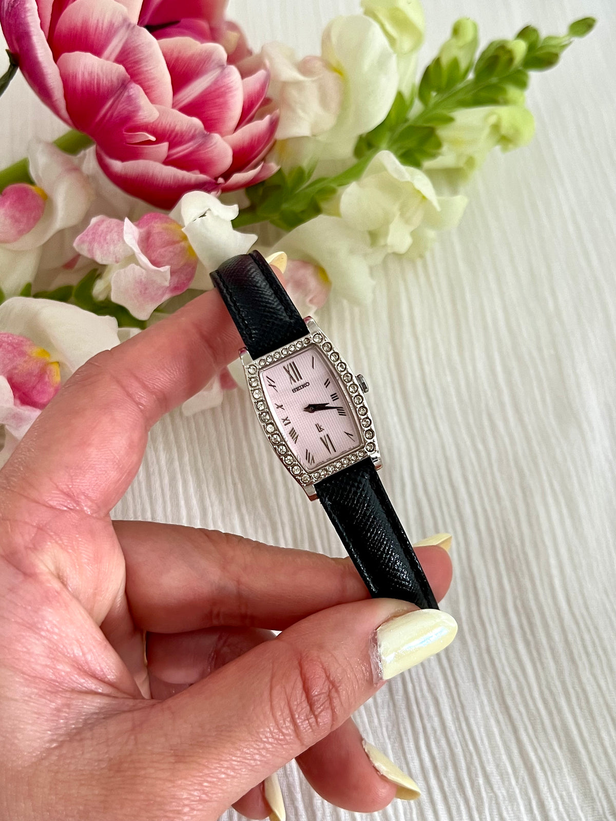 Seiko Lukia Pink Diamond watch — watch held in hand