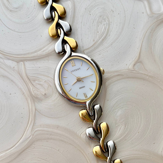 Seiko Lucent Woman's Watch with a Pink Pearlescent Dial, case profile of a vintage women's watch at Gilded Hour.