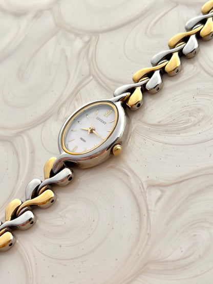 Angled view of Seiko Lucent oval case, pearlescent dial and two-tone links
